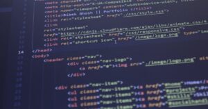 Close-up view of HTML and CSS code displayed on a computer screen, ideal for programming and technology themes.